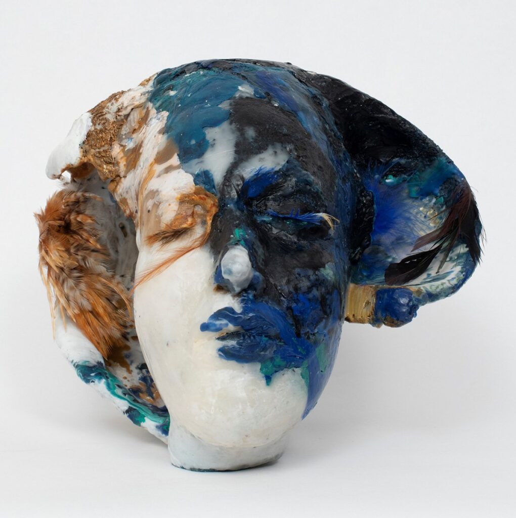 Egyptian Head, by Nava Gidanian-Kagan, 2022, resin, pigment, wire, plaster, epoxy, fabric, and feathers