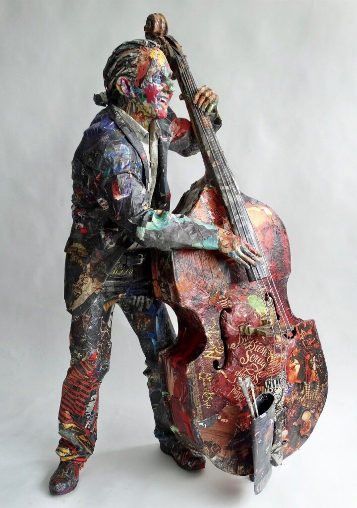 Bass Player, by Will Kurtz, 2019, wood, wire, plaster, newspaper, cardboard, tape, glue, and varnish