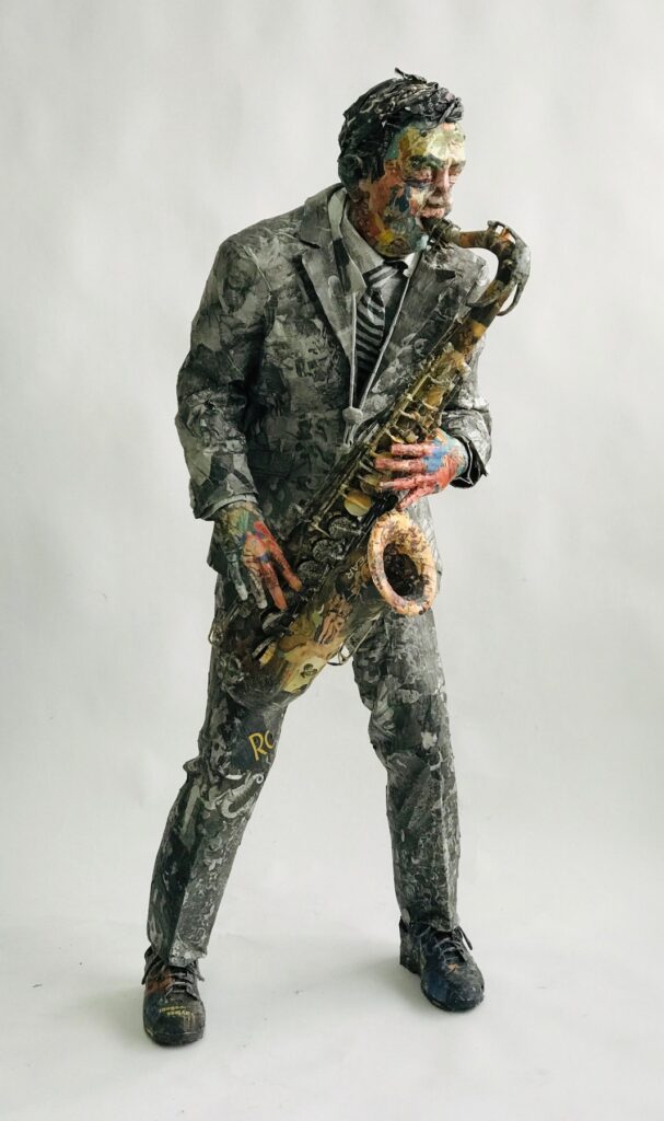 Saxophone Player, by Will Kurtz, 2019, wood, wire, plaster, newspaper, tape, glue, and varnish