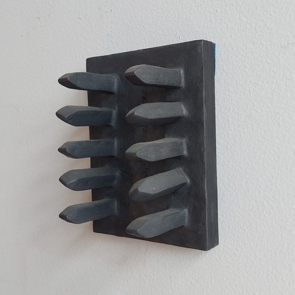 Pathway, by Jess Leo, 2021, clay, graphite powder, and wood