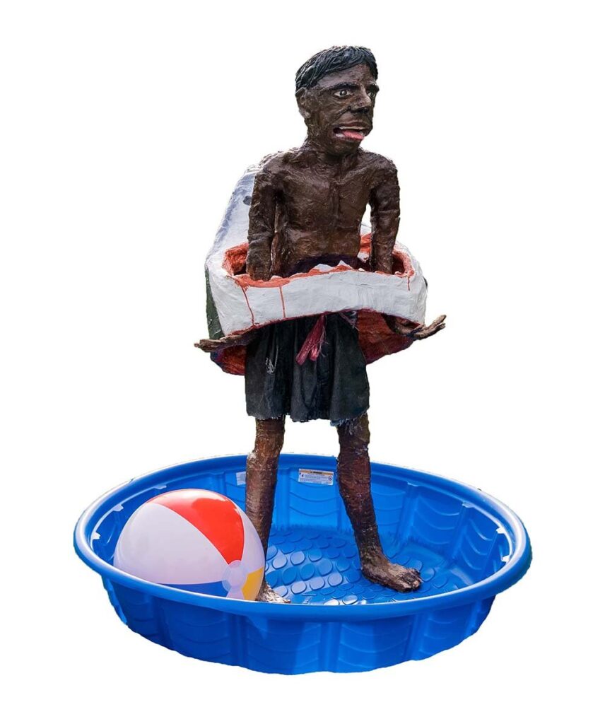 Great White Hope, by Javier Tovias, 2021, clay, plaster, wire, acrylic, plastic, string, swimming pool, sand, and beach ball