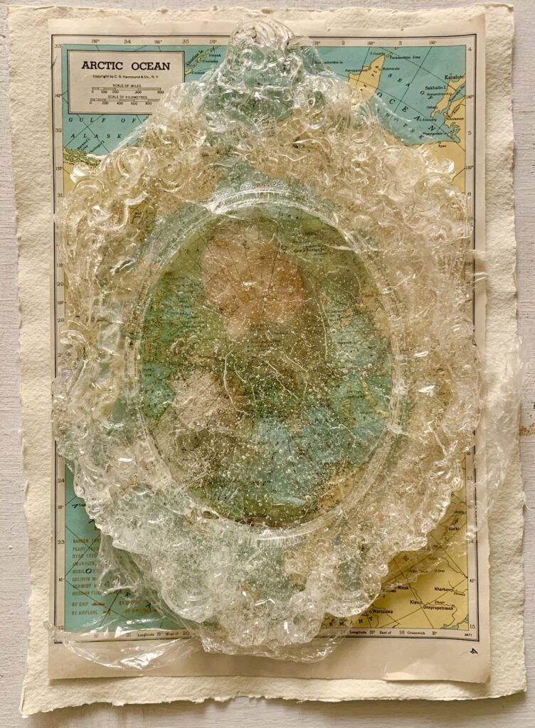 Mend the World 2, by Jennifer Delilah Trammell, 2020, resin, map, and handmade paper