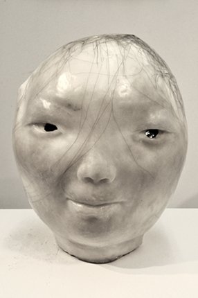 Girl, by Yi Cao, 2011, plaster, and hair