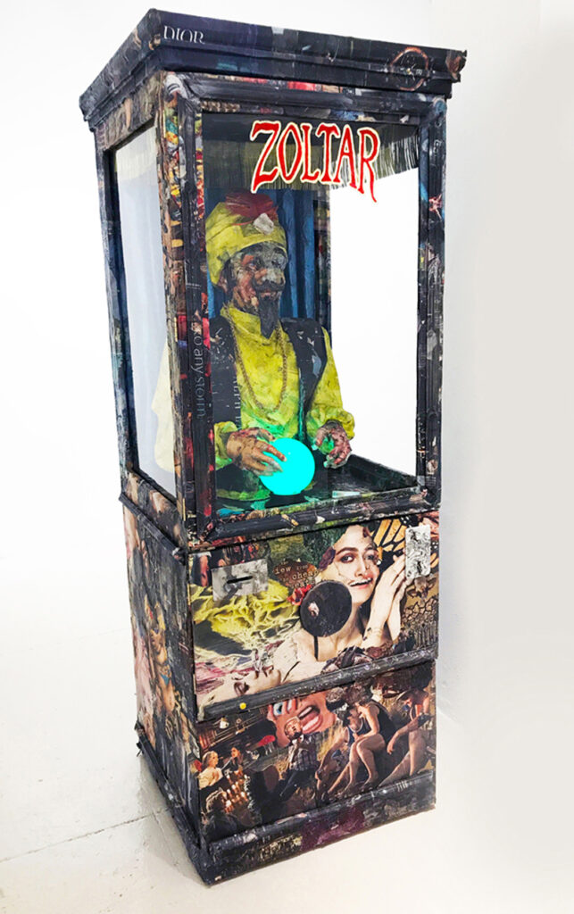Zoltar, by Will Kurtz, 2017, wood, wire, cardboard, newspaper, tape, glue, medium, varnish, ink, light fixture